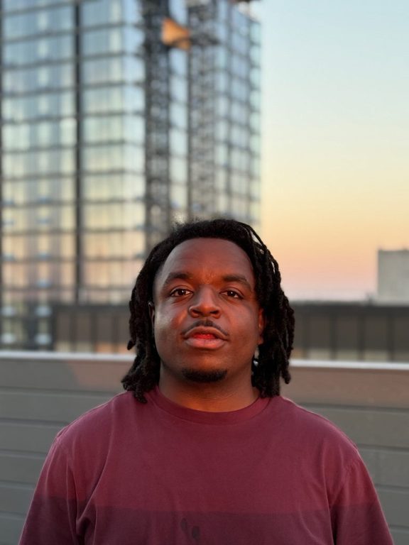 Mr. Crash on a Des Moines rooftop at sunset